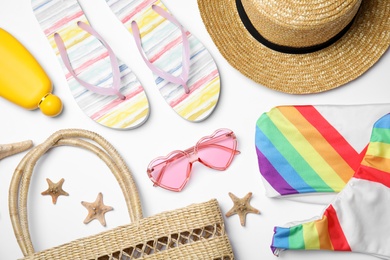 Photo of Flat lay composition with beach objects on white background