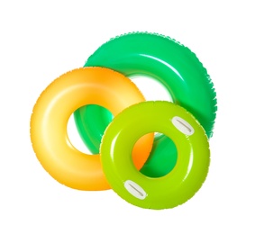 Photo of Different inflatable rings on white background. Summer holidays