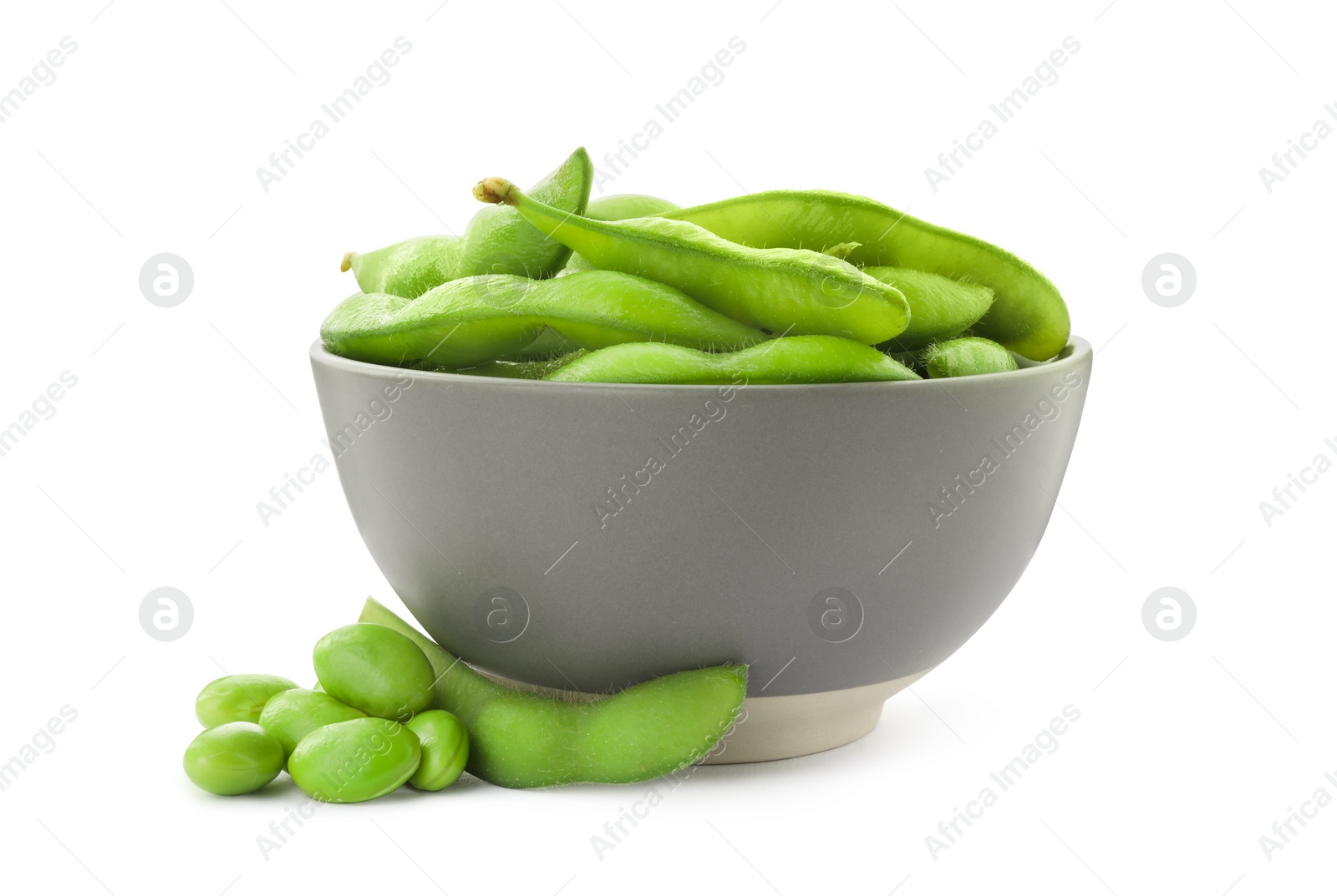 Photo of Bowl with green edamame pods and beans on white background