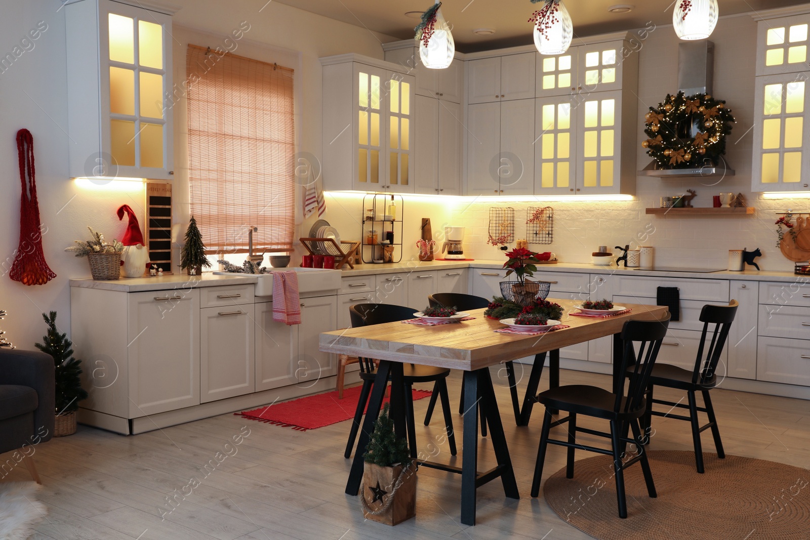 Photo of Cozy dining room interior with beautiful Christmas wreath and festive decor