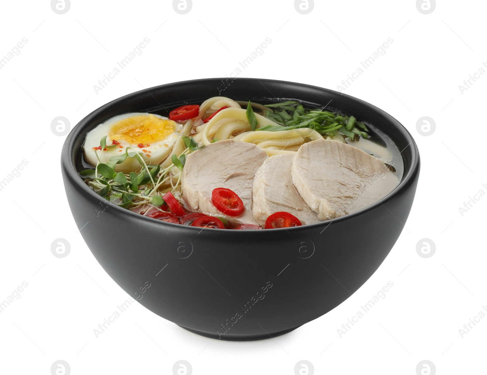 Photo of Delicious ramen with meat and egg in bowl isolated on white. Noodle soup