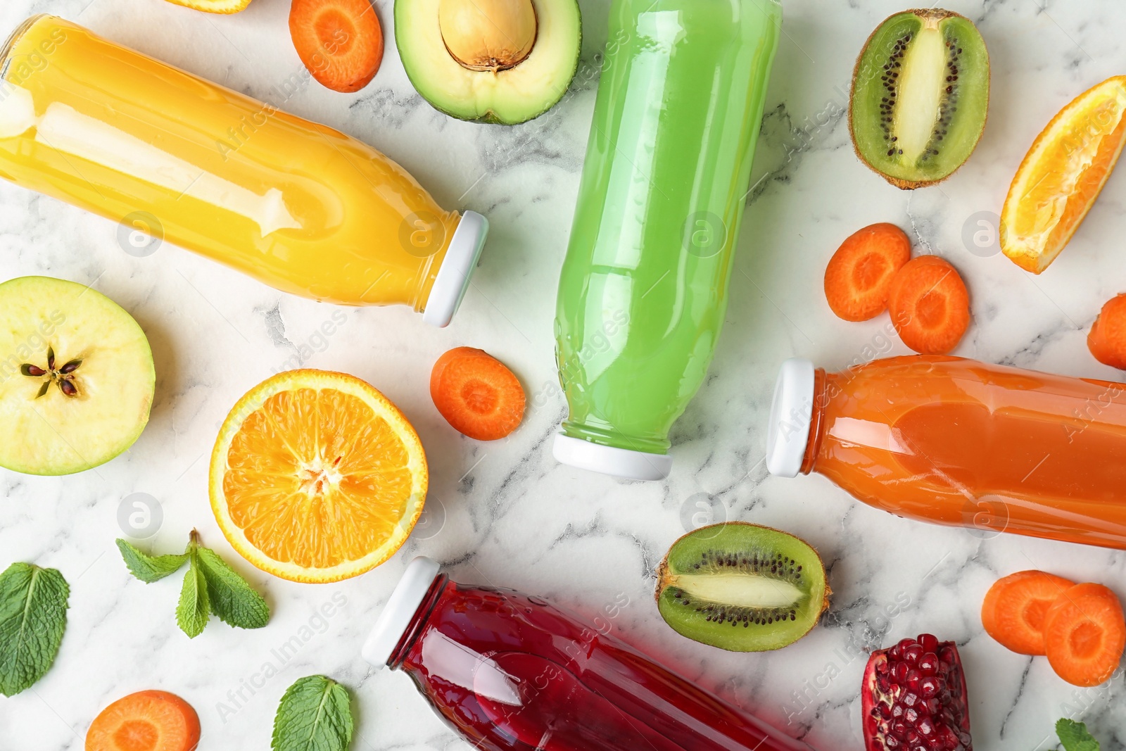 Photo of Flat lay composition with tasty juices and ingredients on marble background