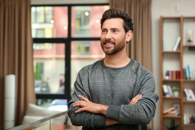 Photo of Portrait of handsome stylish man in office