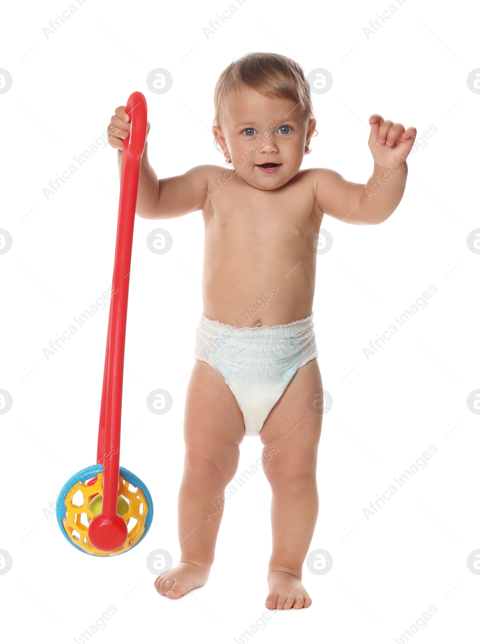 Photo of Cute baby with push toy learning to walk on white background