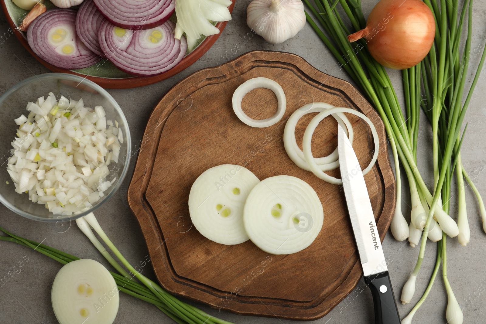 Photo of Flat lay composition with onion on grey table