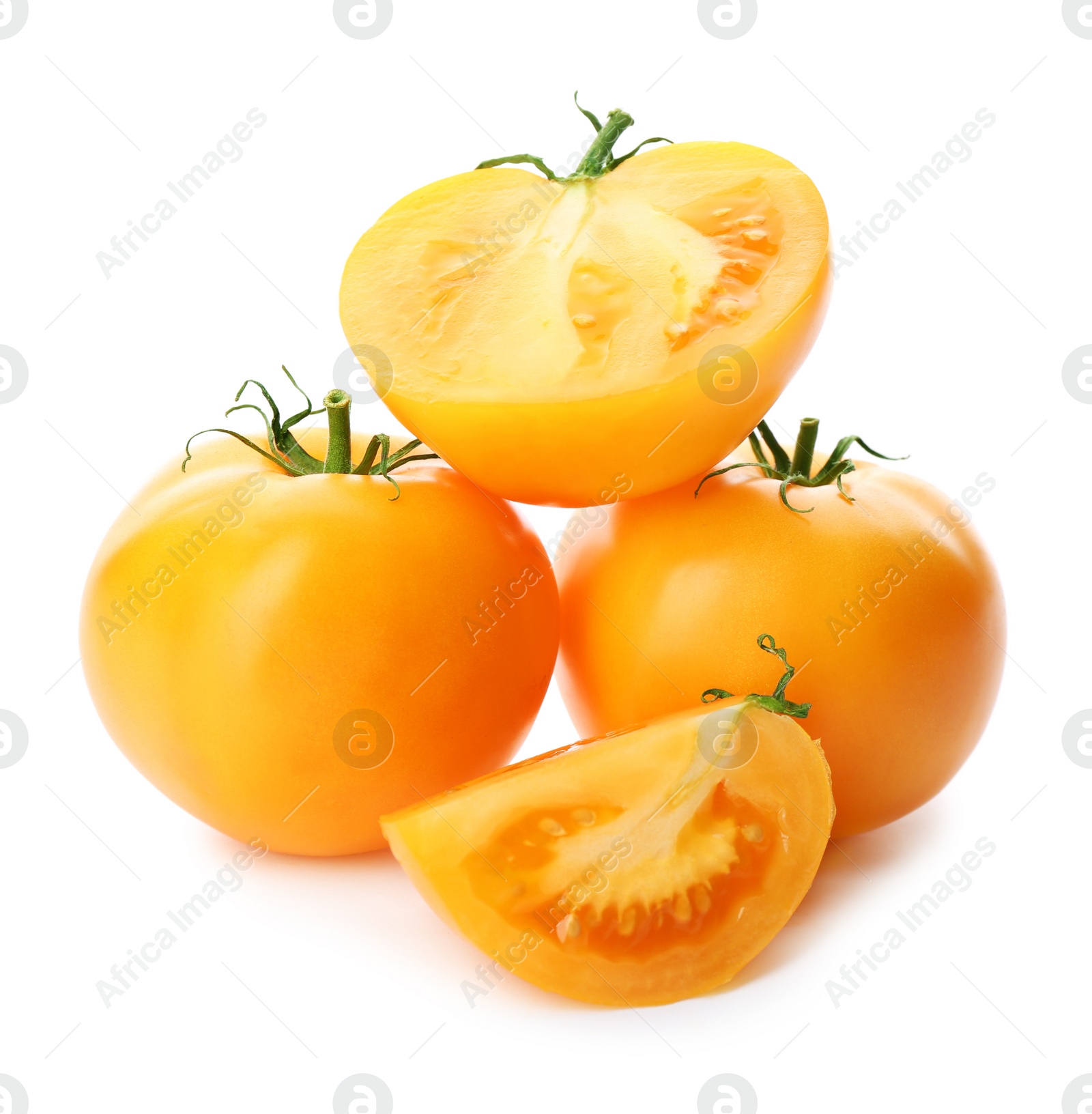 Photo of Cut ripe yellow tomatoes isolated on white