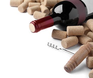 Photo of Corkscrew with wine bottle and stoppers on white background