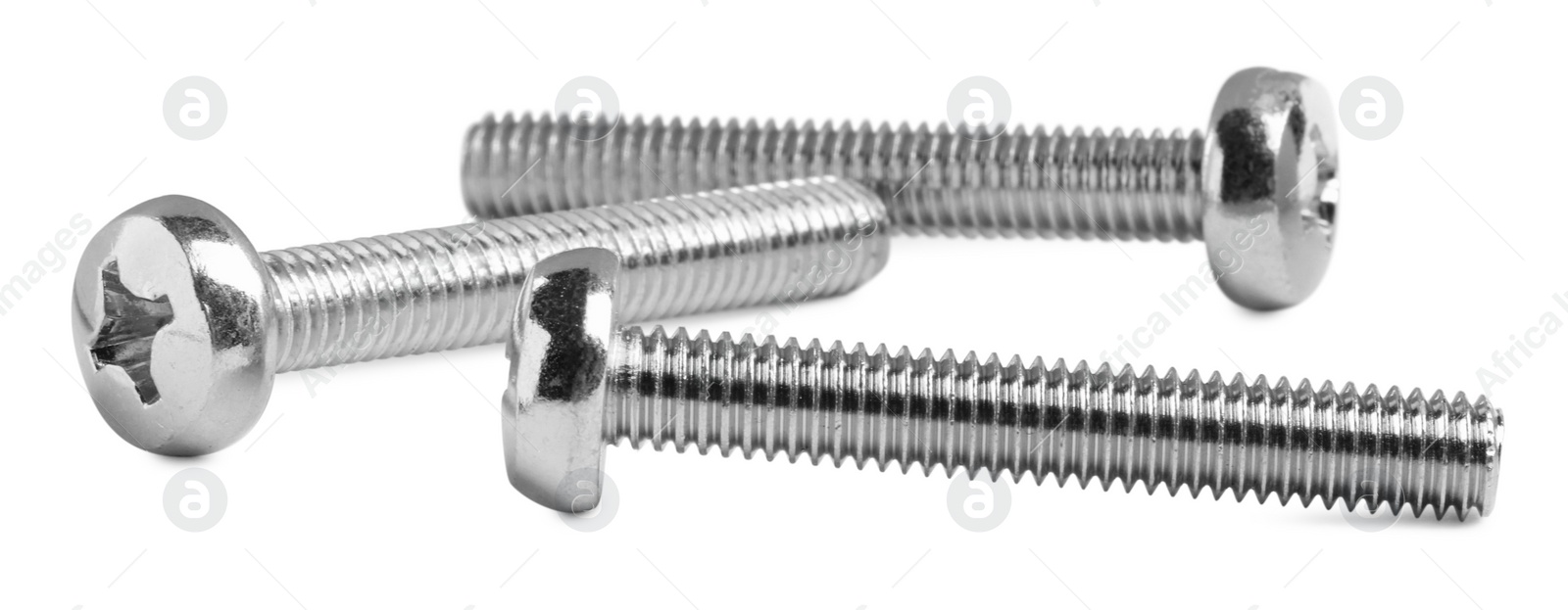 Photo of Three metal machine screw bolts isolated on white