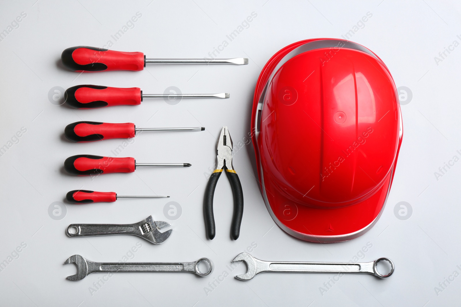 Photo of Flat lay composition with different construction tools on white background