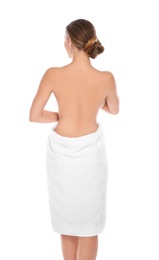 Young woman with soft towel on white background