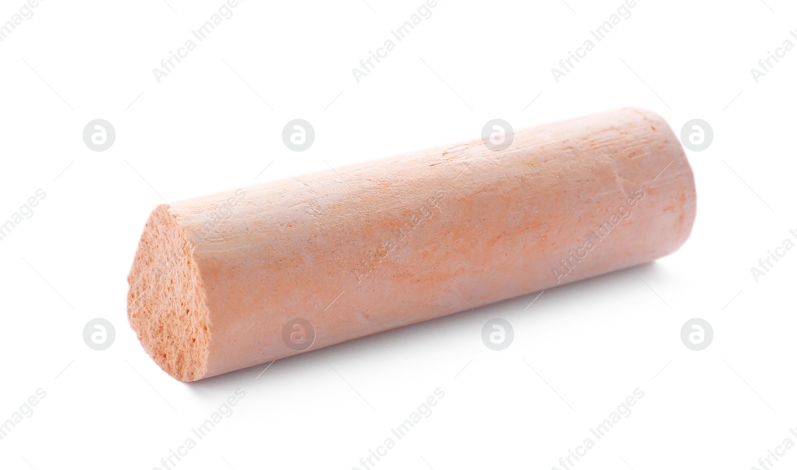 Photo of Small piece of orange chalk isolated on white