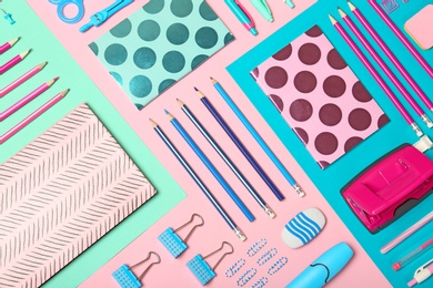 Flat lay composition with different school stationery on color background