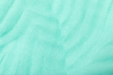 Texture of turquoise fabric as background, top view