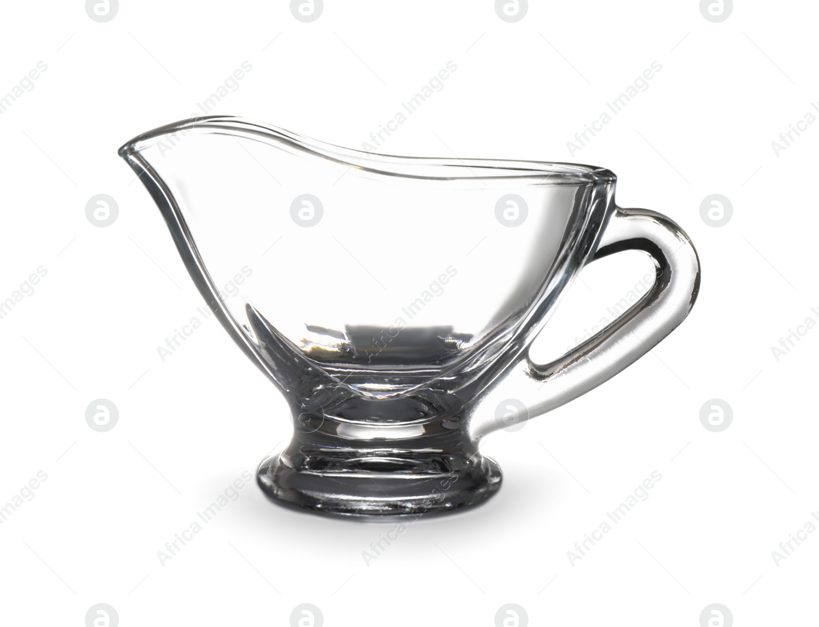 Photo of Empty glass sauce boat isolated on white