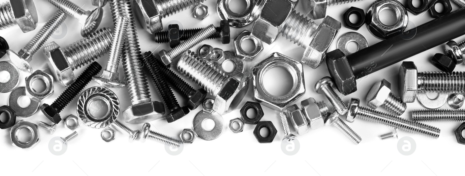 Photo of Different metal bolts and nuts on white background, top view