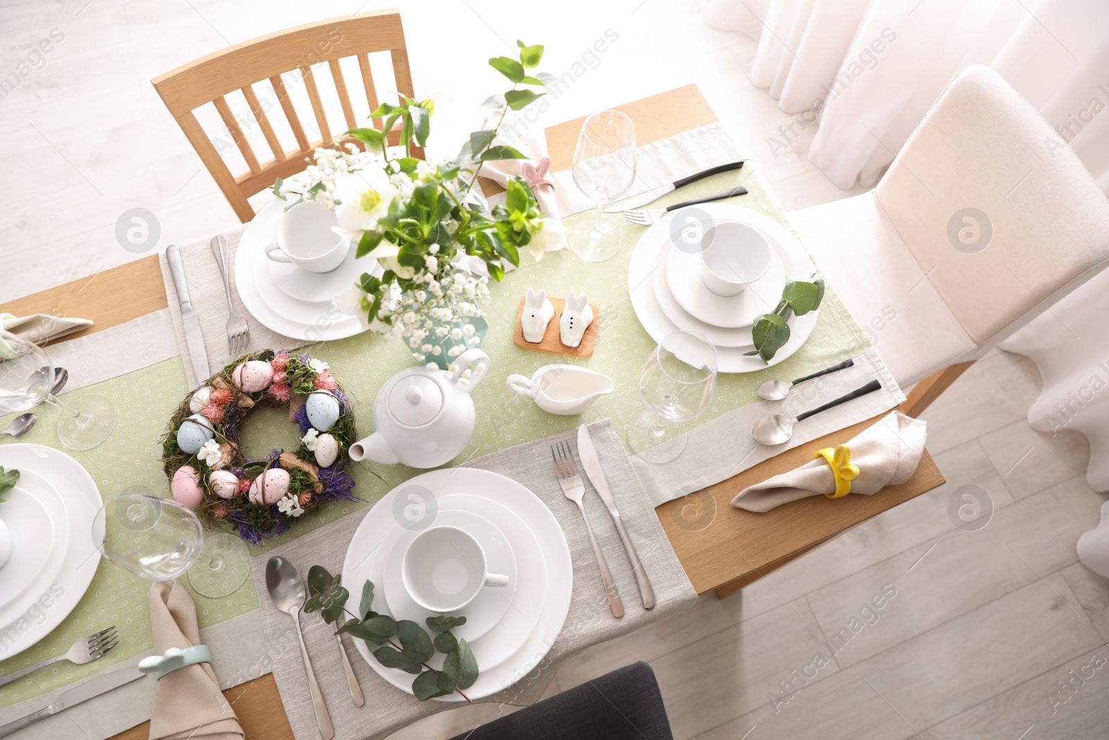 Photo of Beautiful Easter table setting with festive decor indoors, above view