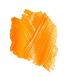 Photo of Abstract brushstroke of orange paint isolated on white