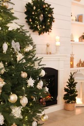 Stylish living room interior with decorated Christmas tree and fireplace