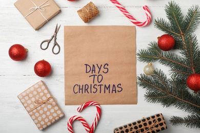 Photo of Flat lay composition with festive decor on wooden background. Christmas countdown