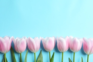 Beautiful tulips for Mother's Day on color background