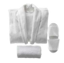 Photo of Clean folded bathrobe, slippers and towel isolated on white, top view