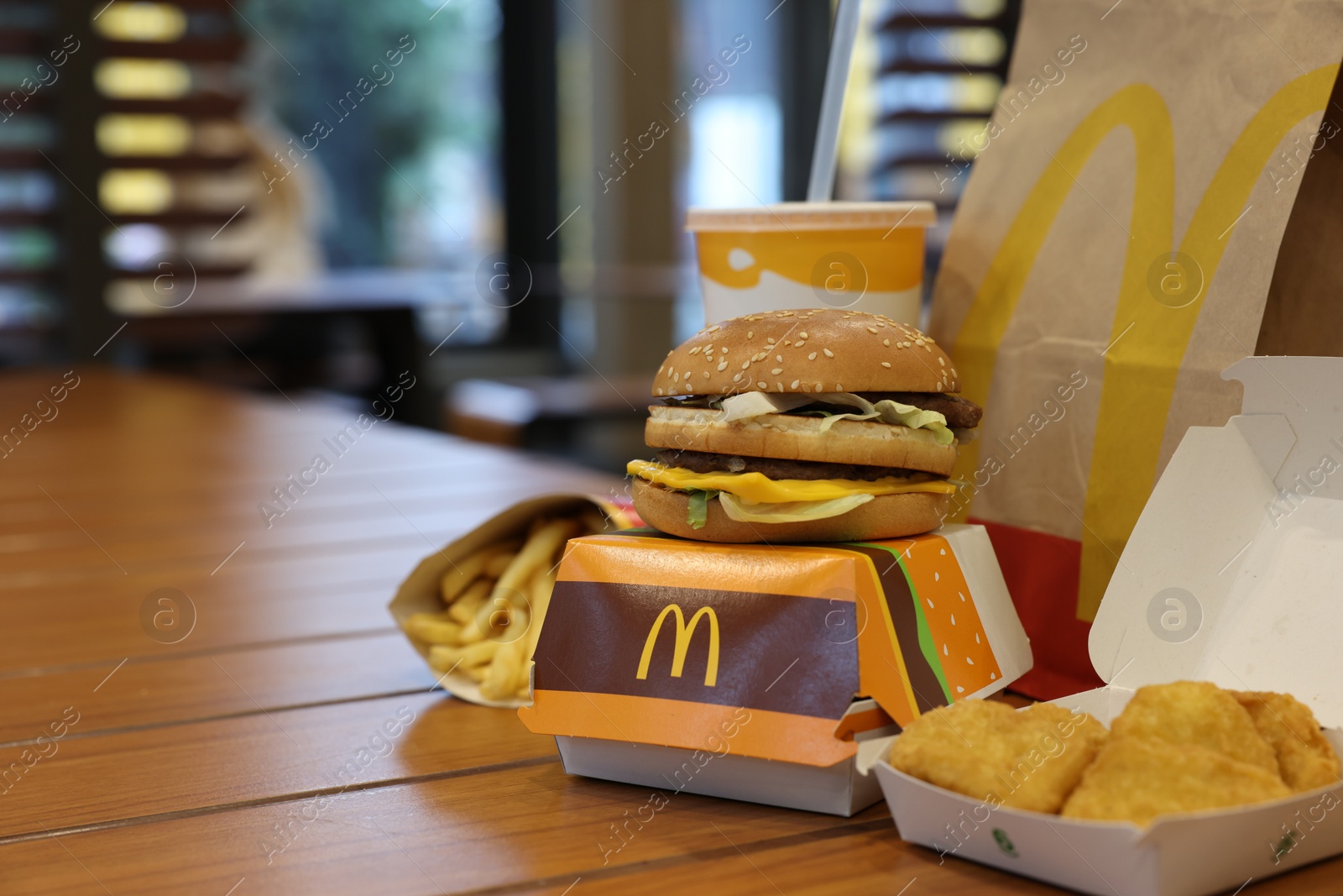 Photo of Lviv, Ukraine - October 9, 2023: McDonald's menu on wooden table in restaurant, space for text