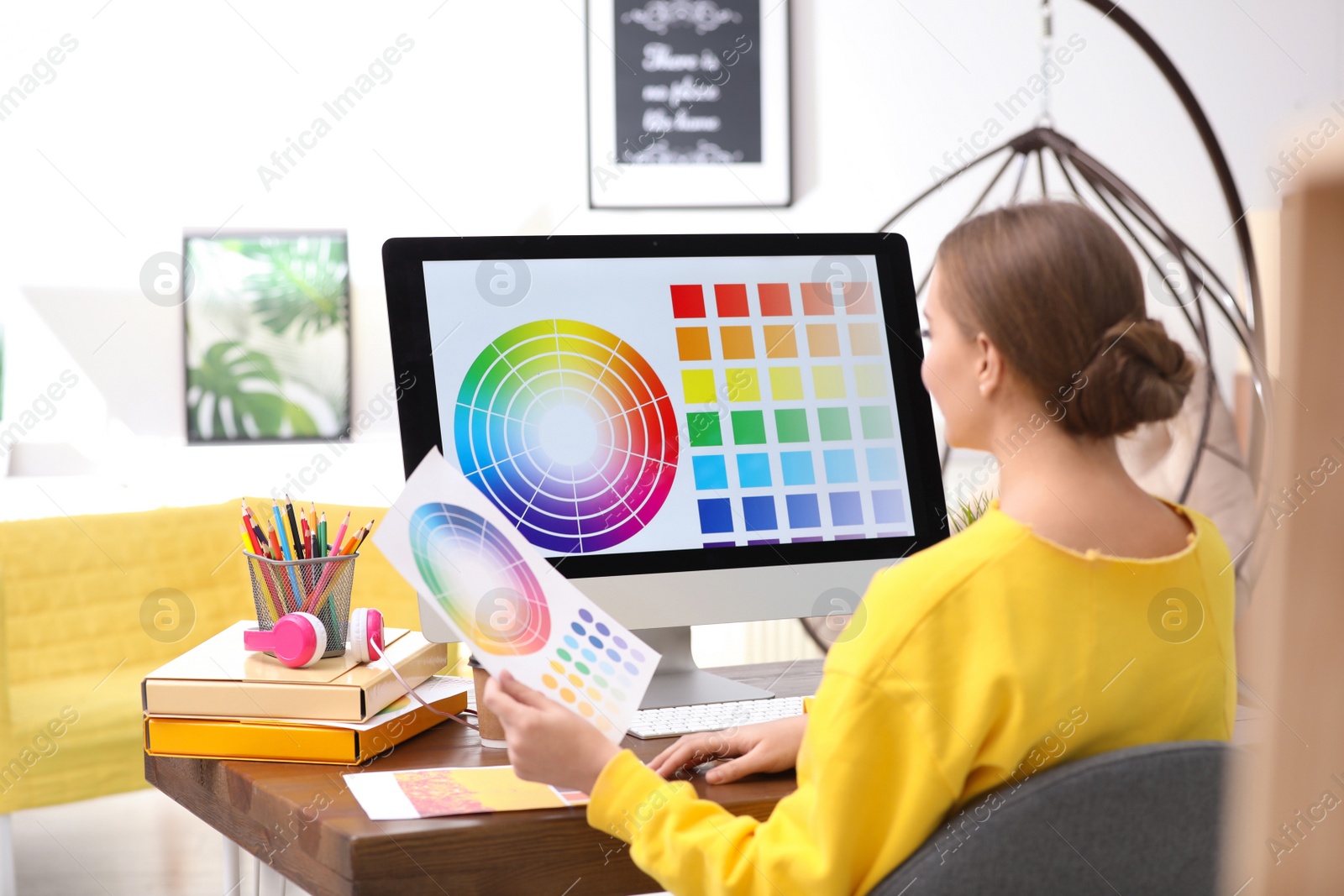 Photo of Professional designer working with computer at table in office