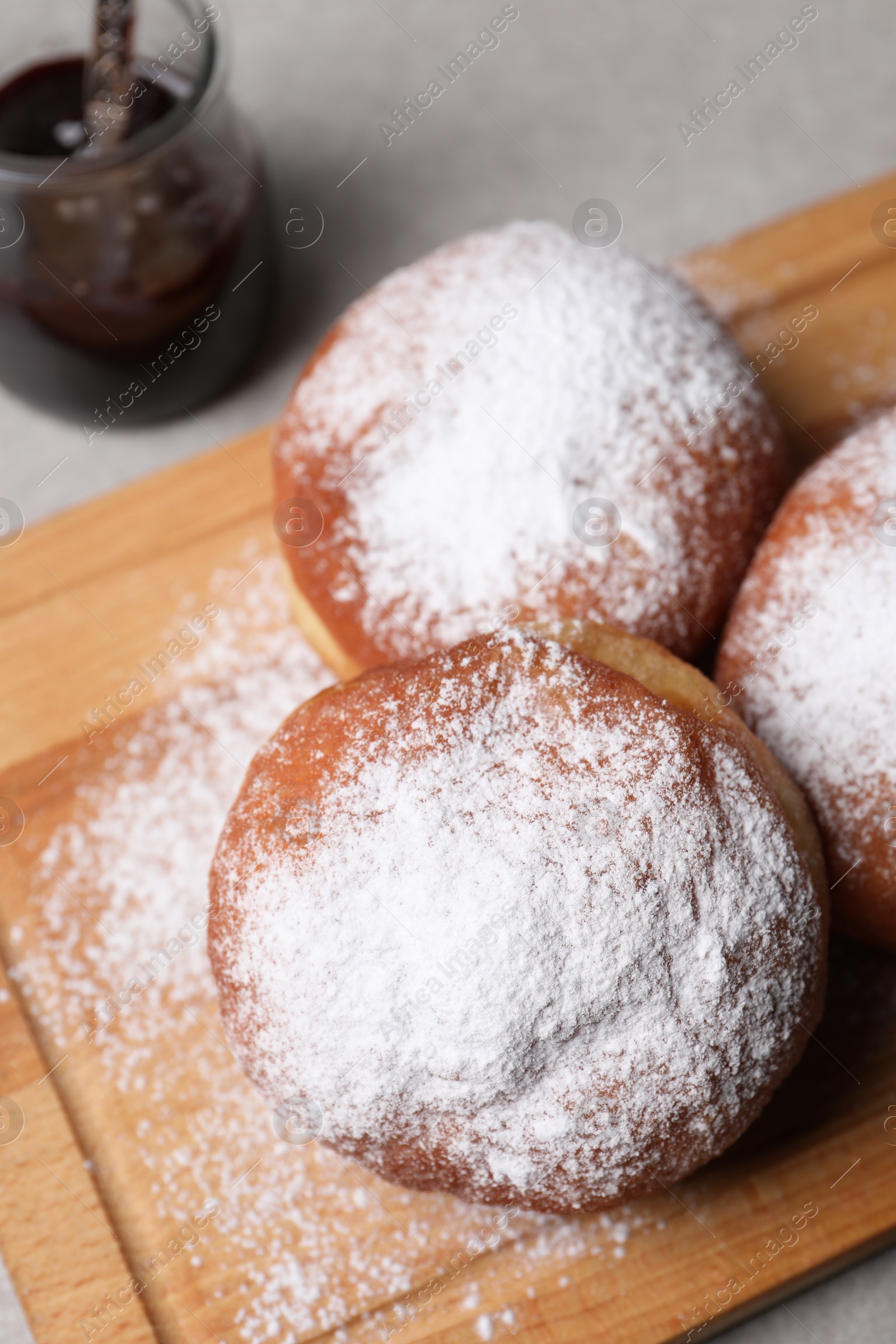 Photo of Delicious sweet buns with jam on table, closeup