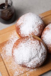 Delicious sweet buns with jam on table, closeup
