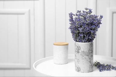Photo of Fresh lavender flowers in vase on table against white wooden background, space for text