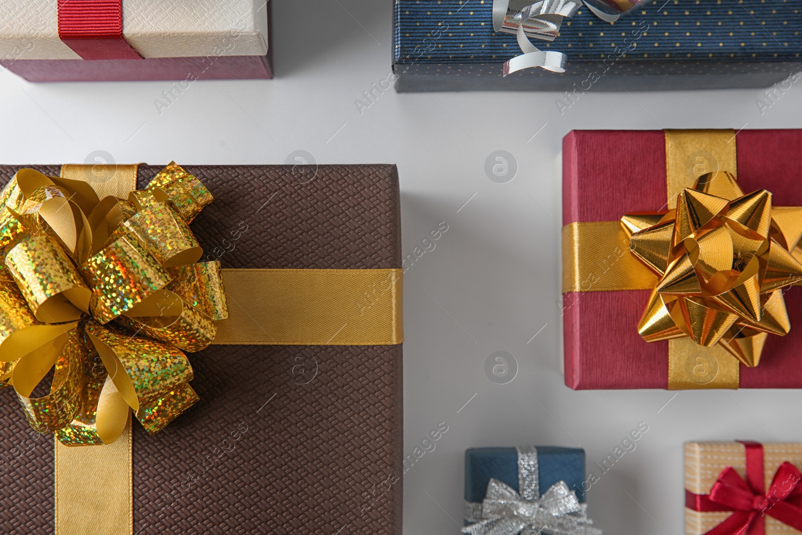 Photo of Beautiful gift boxes with bows on white background, top view