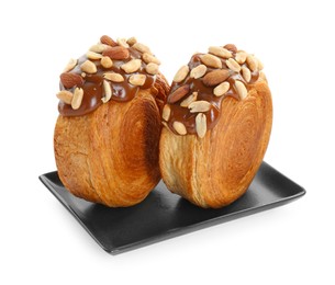 Photo of Round croissants with chocolate paste and nuts isolated on white. Tasty puff pastry