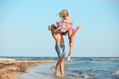 Young couple spending time together on beach