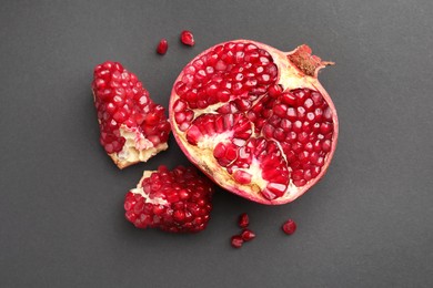 Fresh ripe pomegranate on grey background, top view