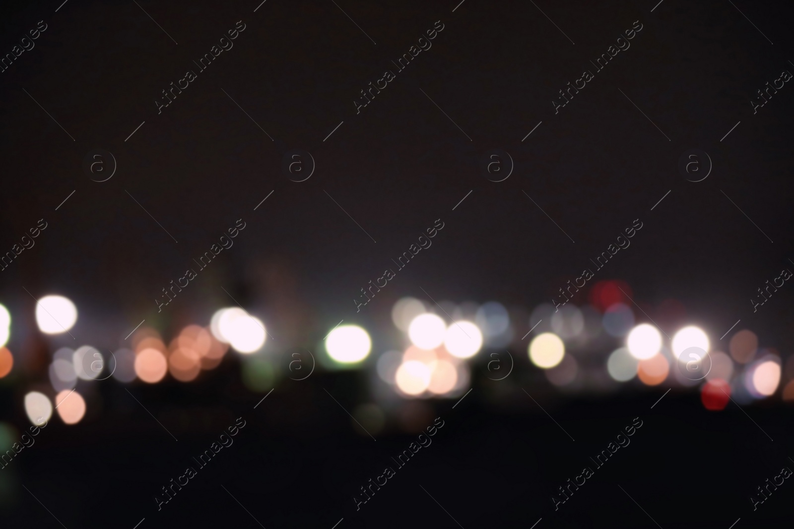 Photo of Blurred view of port at night. Bokeh effect