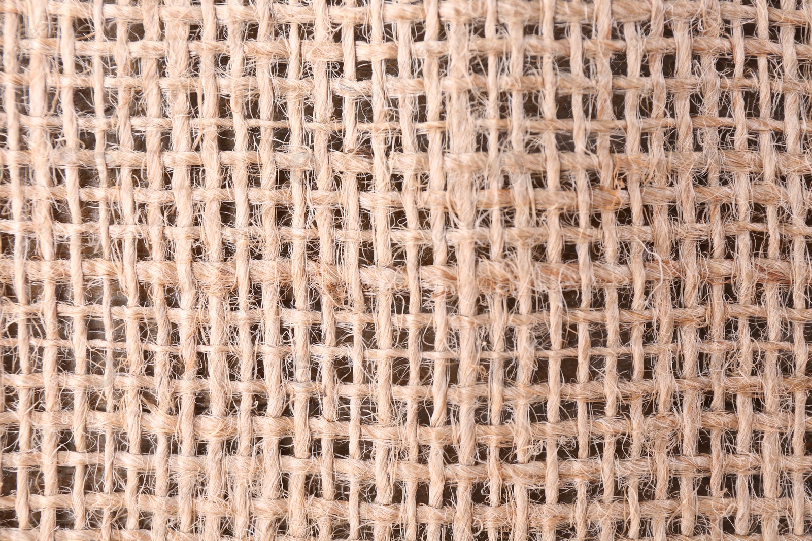 Photo of Piece of burlap fabric as background, top view