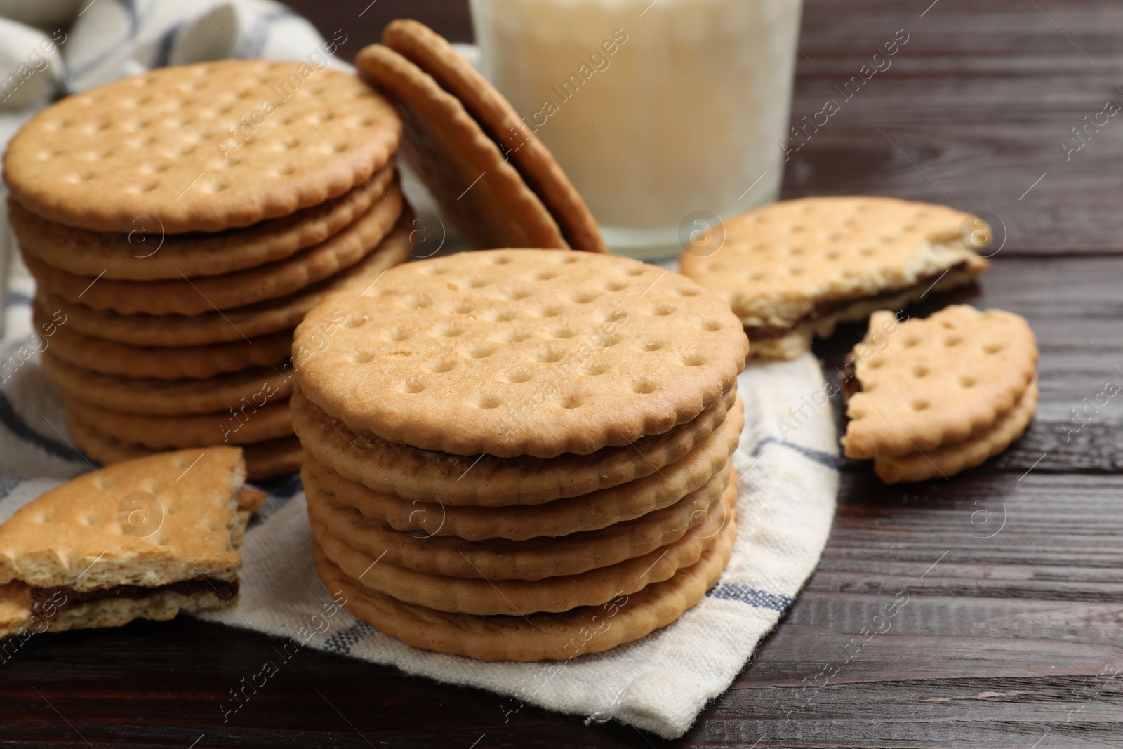 Photo of Tasty sandwich cookies on wooden table, closeup