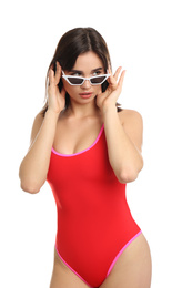 Photo of Beautiful young woman wearing swimsuit and sunglasses on white background