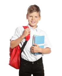 Photo of Cute boy with school stationery on white background