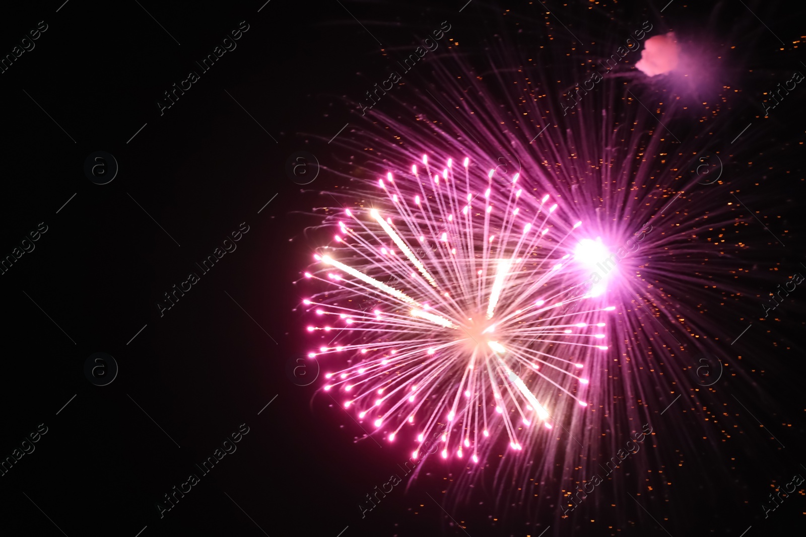 Photo of Beautiful bright fireworks lighting up night sky