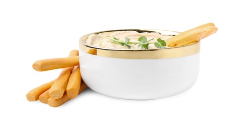 Photo of Delicious hummus with grissini sticks isolated on white