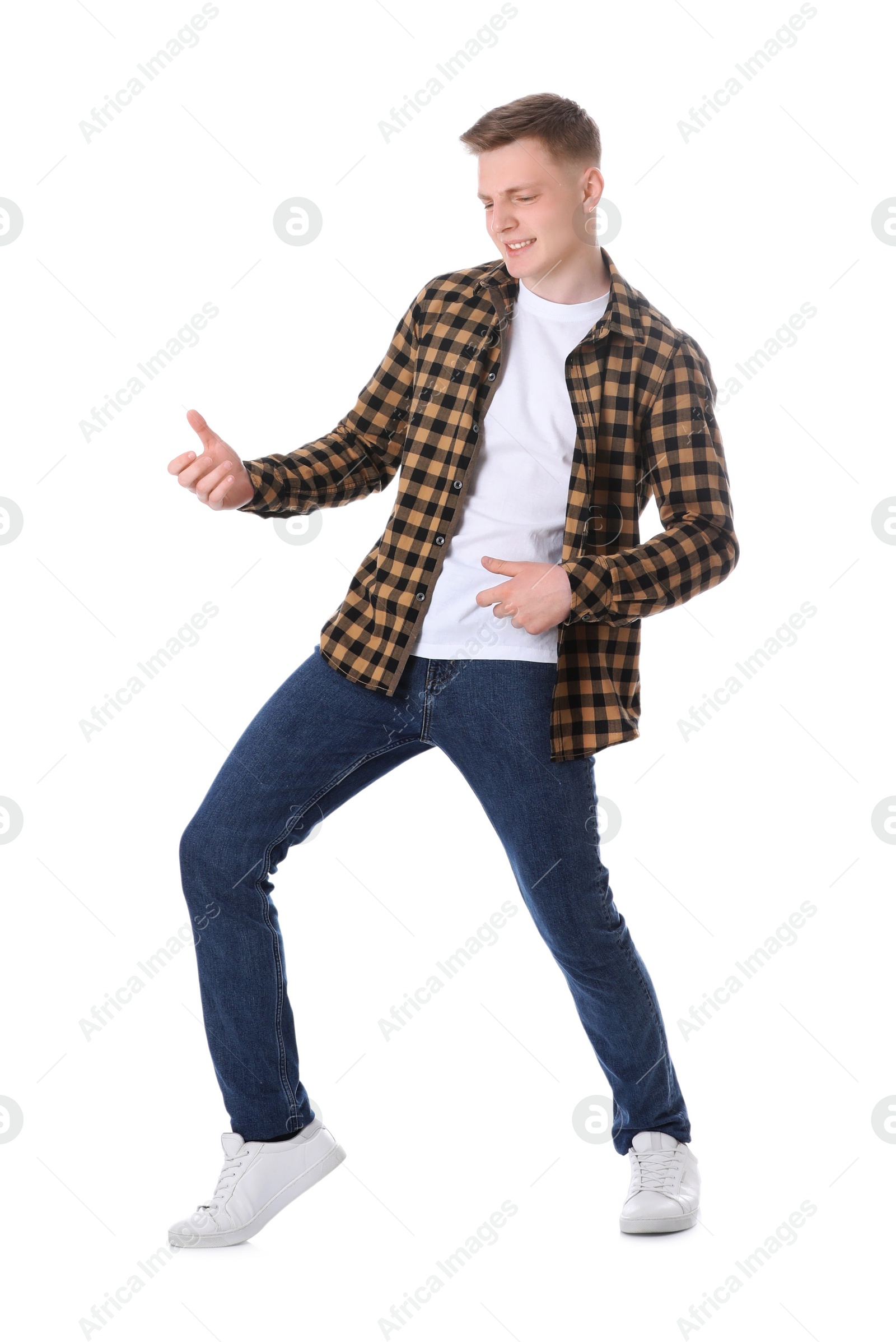 Photo of Full length portrait of happy teenage boy on white background