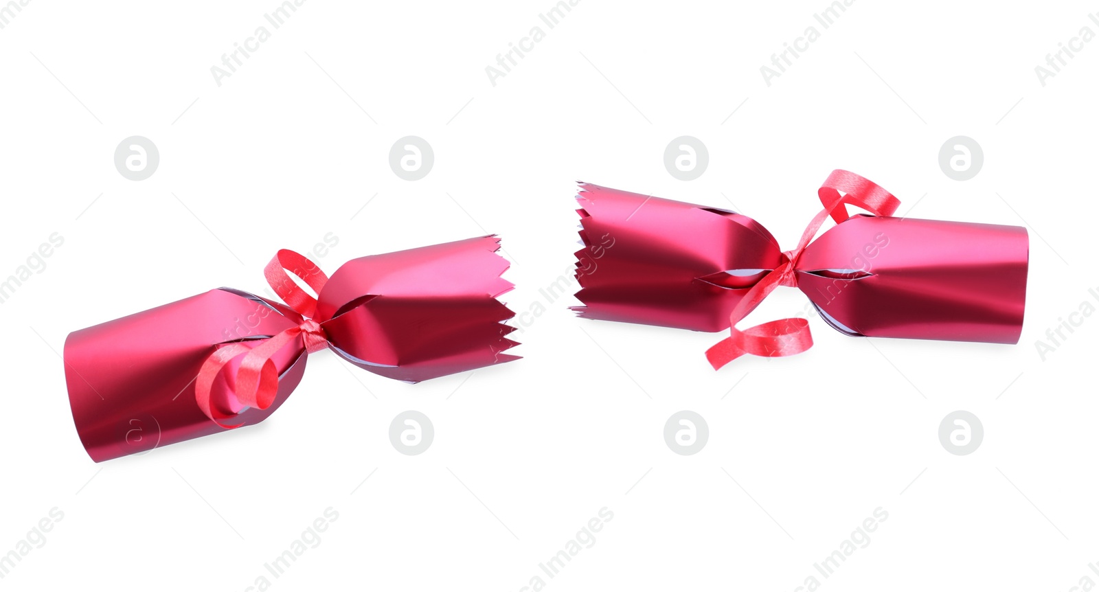 Photo of Open red Christmas cracker isolated on white, top view