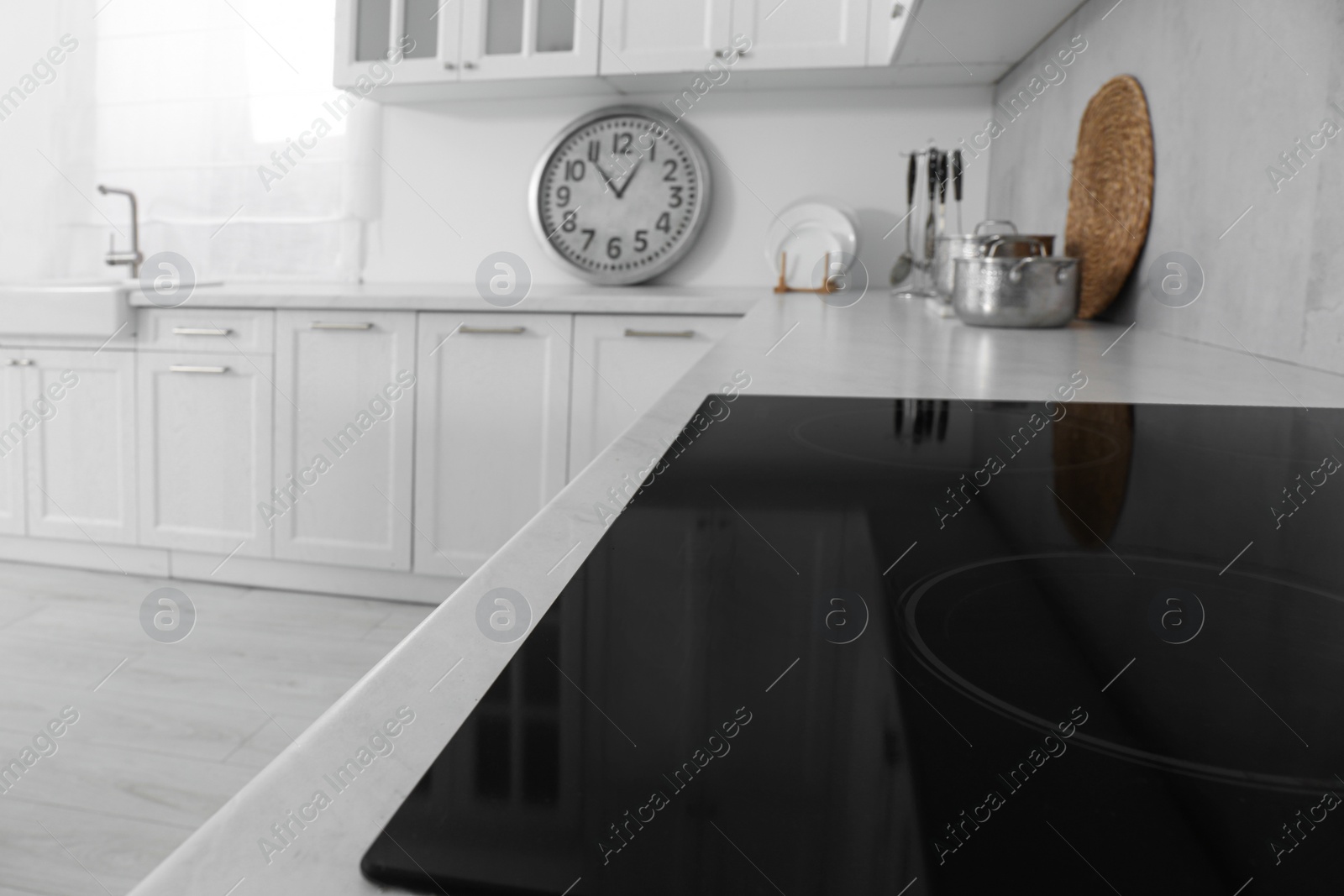 Photo of Modern inductive cooktop in kitchen. Interior design