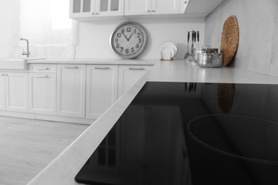 Modern inductive cooktop in kitchen. Interior design
