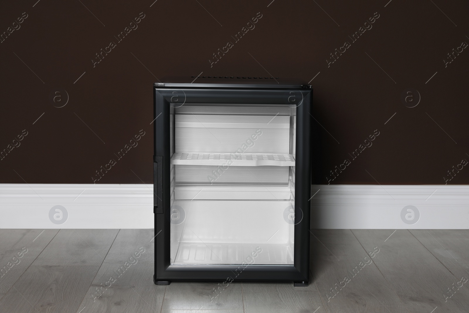 Photo of Empty mini bar near brown wall indoors