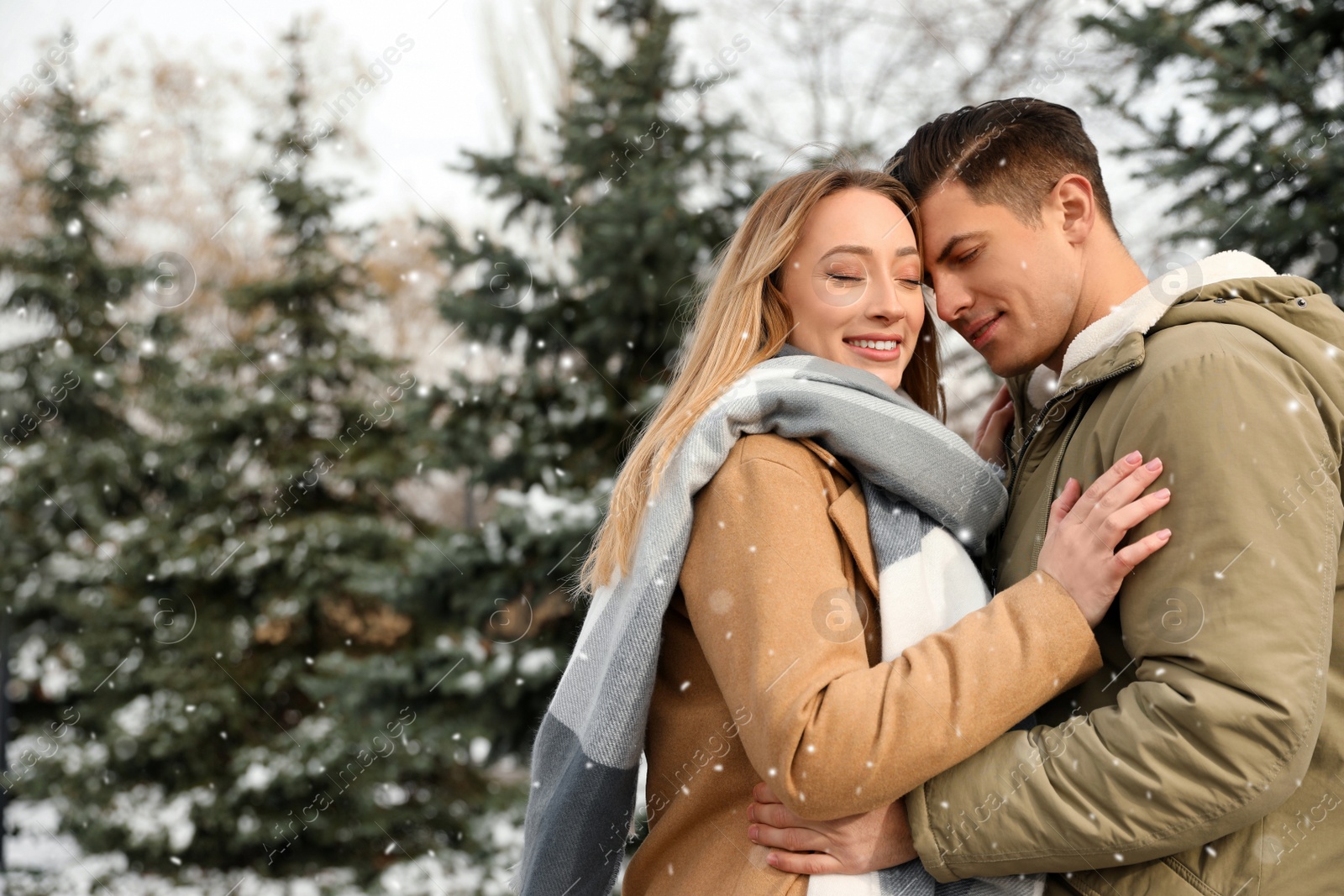 Photo of Beautiful happy couple outdoors on winter day