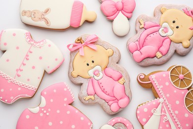 Photo of Cute tasty cookies of different shapes on white background, top view. Baby shower party