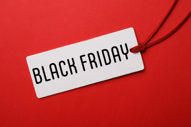 Image of Tag with text BLACK FRIDAY on red background, top view