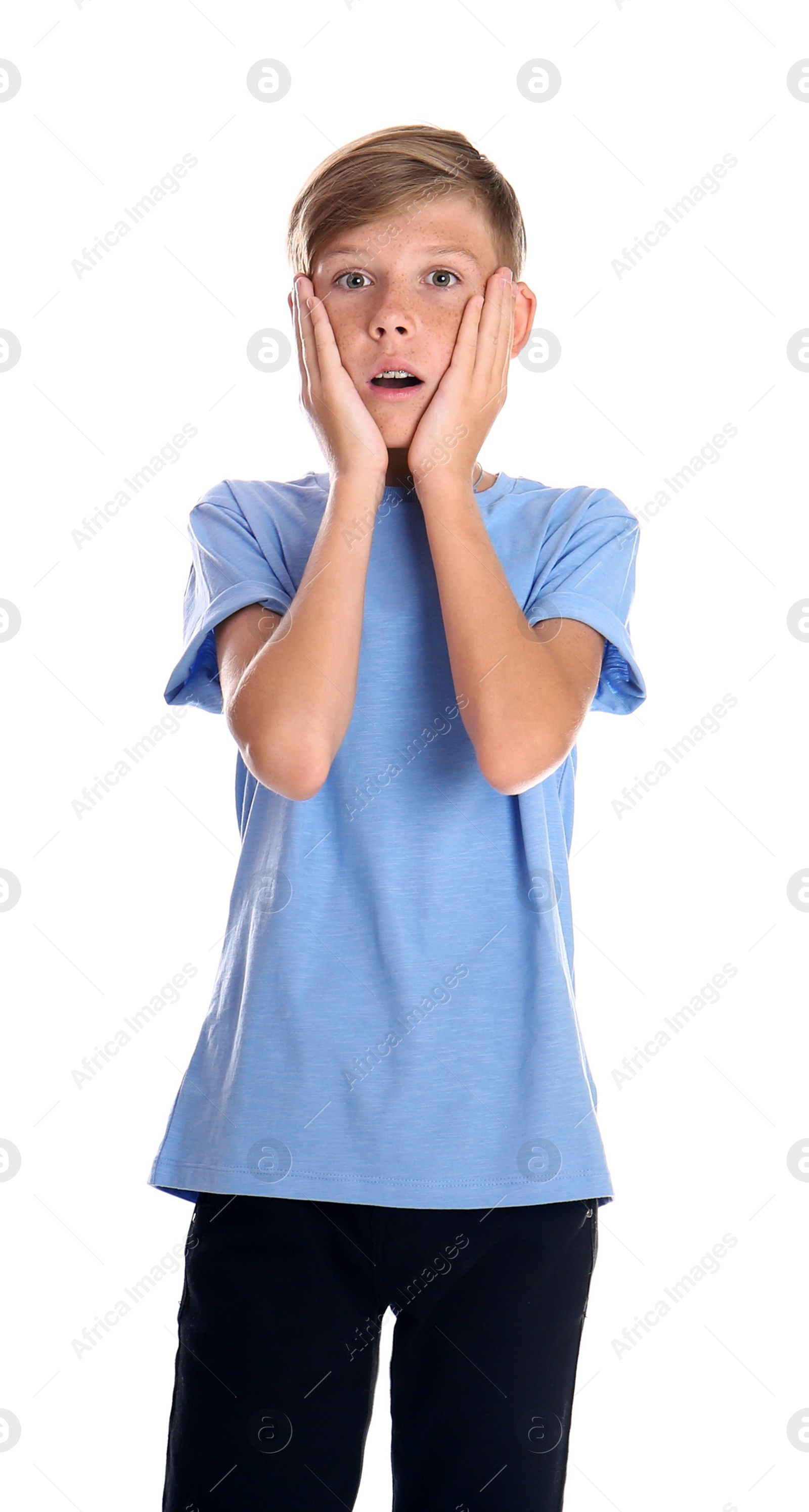 Photo of Portrait of young boy standing against white background